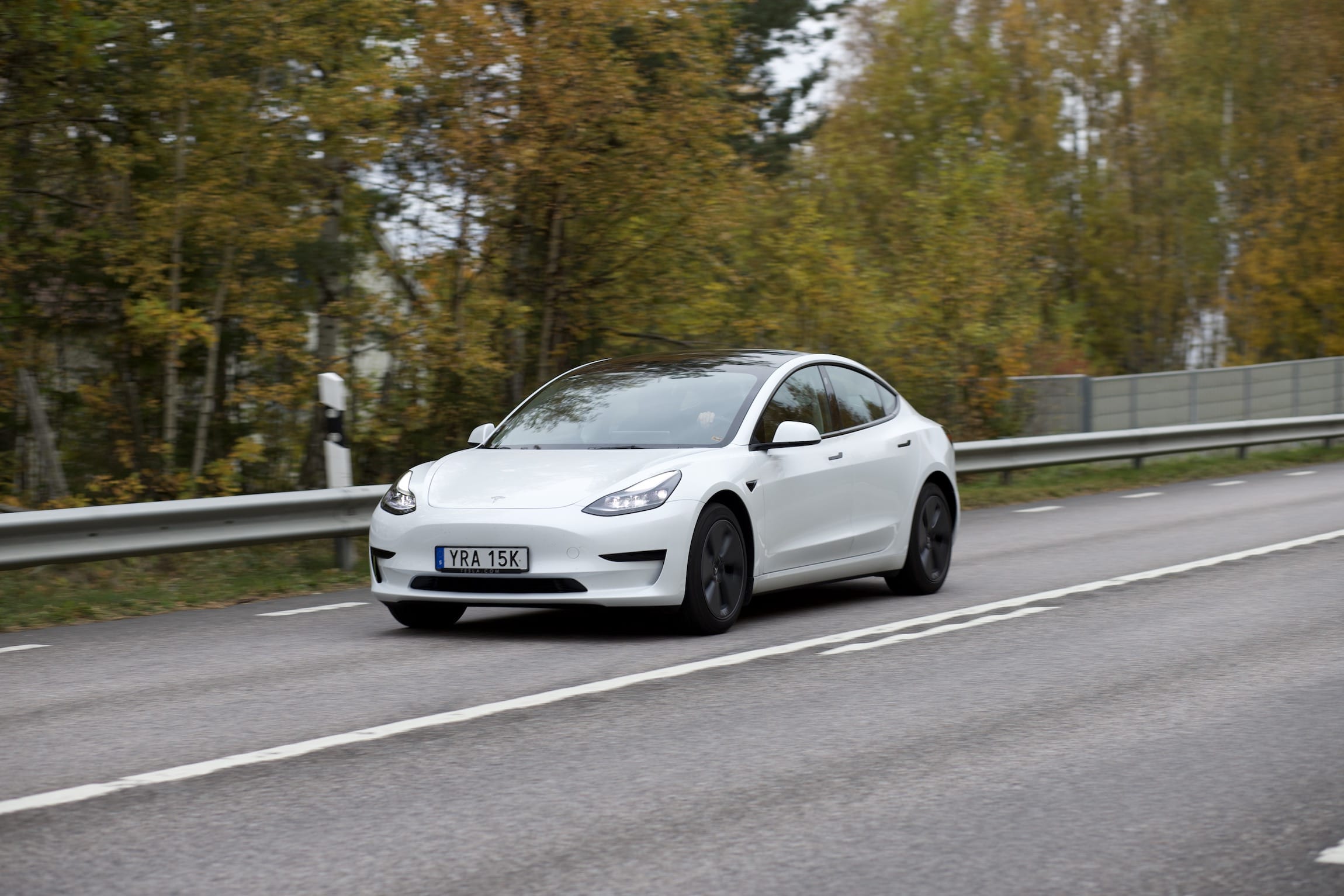 Tesla Model 3 driving by